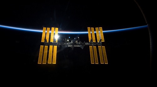 International Space Station orbits in dark sky